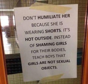 A sign addressing the issue of sexism in dress codes is on display in a school