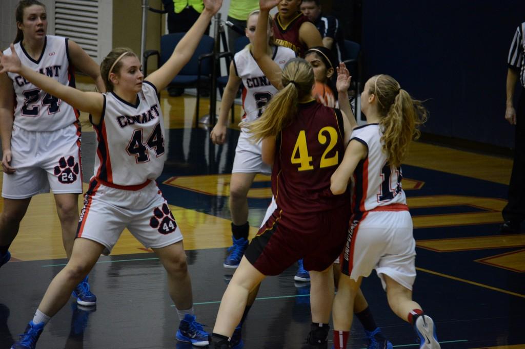 The girls defense swarms the Schaumburg player as she tries to attack the paint.
