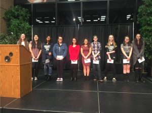 Students receive their awards at the Harper Art Show 