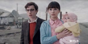 (from left to right) Klaus, Violet and Sunny Baudelaire react to hearing their parents have died.