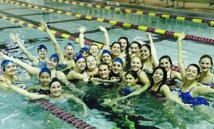 Swim team smiles at practice 