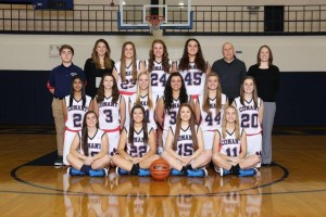 Girls varsity basketball team. (Top row 2nd from left) coach Naughton 