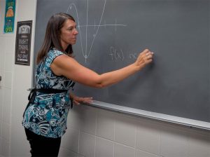 Math teacher Aimee Barkalow teaches slopes to her Calc A class.