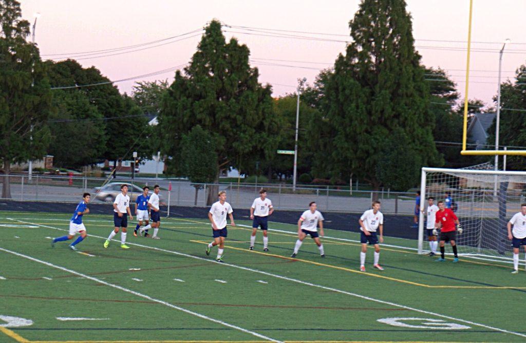 The defense prepares for a Hoffman corner kick.