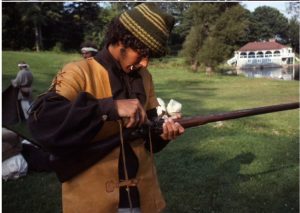 Richard Gross loads his musket.