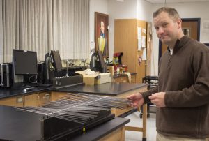 Mr. Kulak explains different types of waves to his students. 